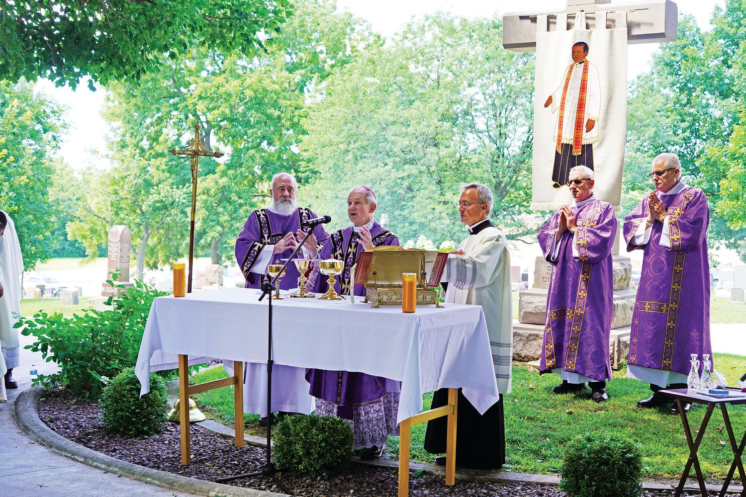 Bishop Thomas J. Paprocki of Springfield, Illinois, offers Mass at the burial place of Venerable Father Augustus Tolton in St. Peter Cemetery in Quincy, Illinois, on July 9, the 125th anniversary of Fr. Tolton’s death. Fr. Tolton, the Roman Catholic Church’s first recognizably Black priest, was born into a family of enslaved people and baptized in St. Peter Church in Brush Creek in what is now part of the Jefferson City diocese. He escaped with his family to Illinois during the Civil War. He is under serious consideration for being declared a Saint.